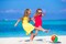 12" Rainbow Colored Party Pack Inflatable Beach Balls - Beach Pool Party Toys (12 Pack)